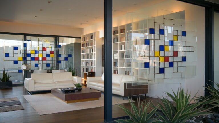 Stained glass wall casting colorful patterns indoors