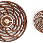 Modern kinetic sculpture wall art in motion with abstract design.