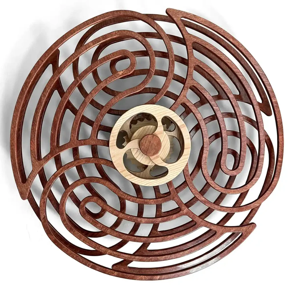 Close-up of kinetic sculpture with intricate moving components.
