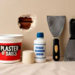 Plaster repair tools and materials set next to a hole in a plaster wall, featuring Plaster of Paris, bonding agent, fiberglass mesh tape, and putty knives.