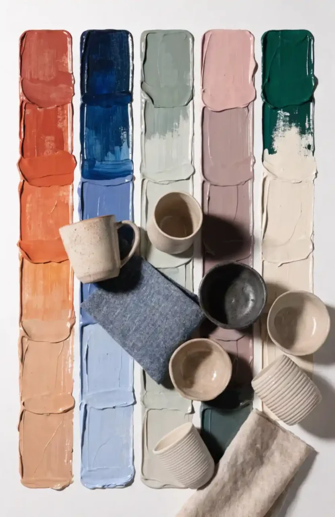 Five trending home color palette strips on white background showing terracotta, navy, sage green, dusty pink, and forest green paint color combinations for 2026 interior design